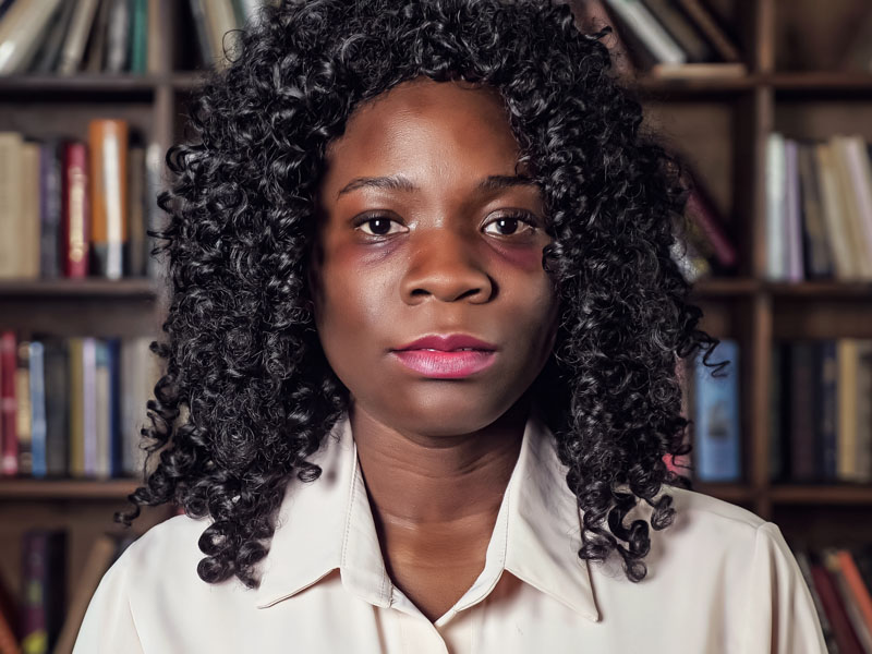 Portrait of an African American woman with bruises. Domestic violence concept